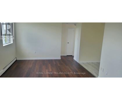 A room with wooden floors and white walls.