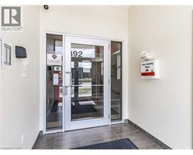 A white door with a glass window and a sign that says "Fire Safety Plan".
