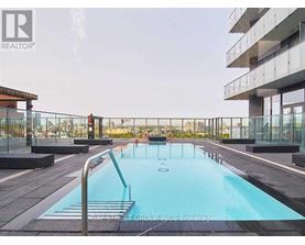A pool on a balcony with people in it.