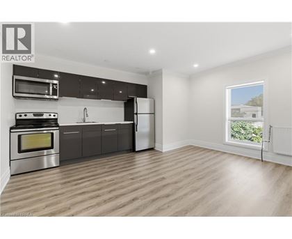 A modern kitchen with a stainless steel oven and microwave above the stove.