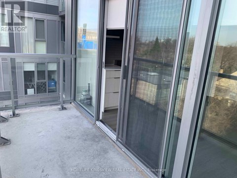 A glass door with a handle is part of a building's exterior.