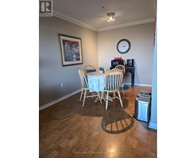 A dining room with a table set for four.