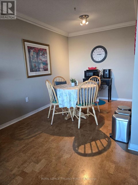A dining room with a table set for four.