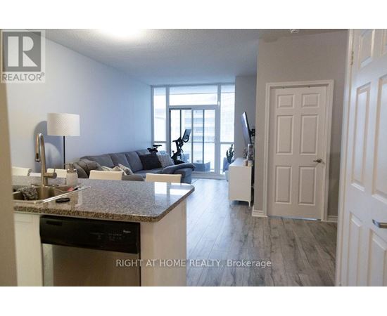 A kitchen with a dishwasher and a countertop with a sink.
