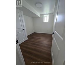 A room with wooden floors and white walls.