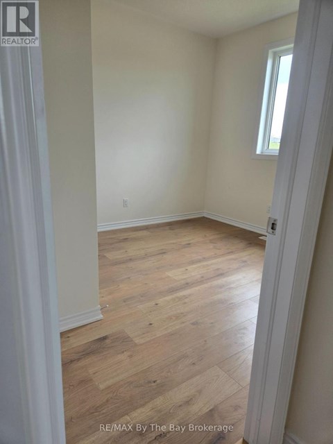A room with wooden floors and white walls.