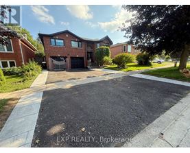 A house with a driveway in front of it.