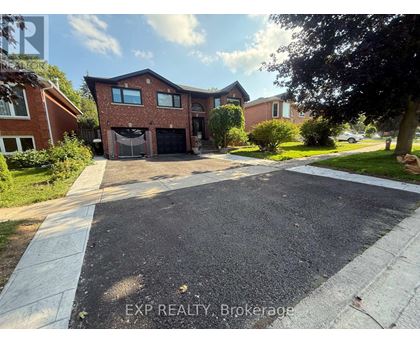 A house with a driveway in front of it.