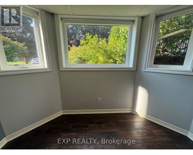 A room with EXP REALTY, Brokerage written on the floor.