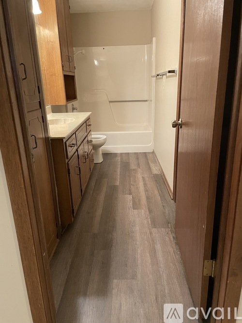 A bathroom with a toilet, sink, and bathtub.