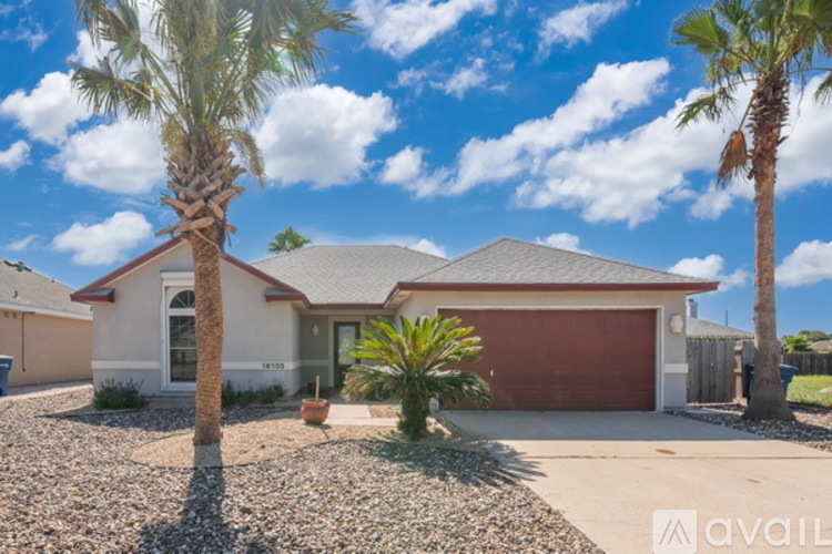 A house with a red garage door is for sale.