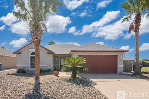 A house with a red garage door is for sale.
