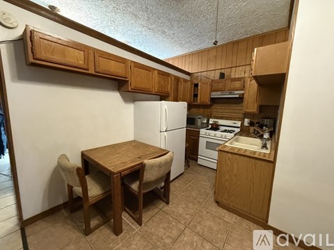 A room with a ceiling fan and a window.