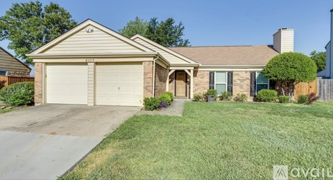 A house with a garage is for sale.