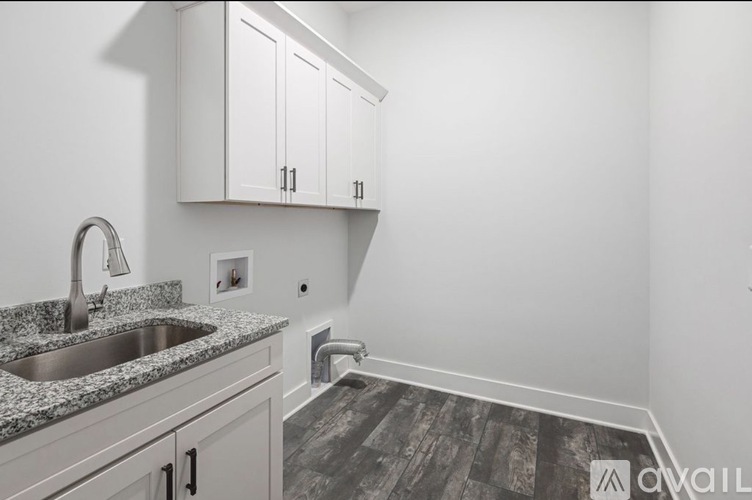 A kitchen with a sink and cabinets.