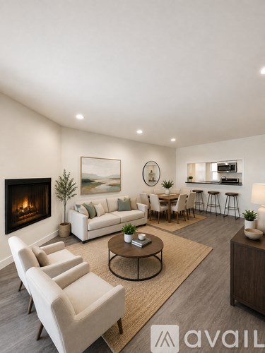 A modern living room with a fireplace and a dining area.