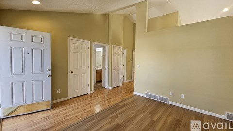 A kitchen with wooden cabinets and white appliances.