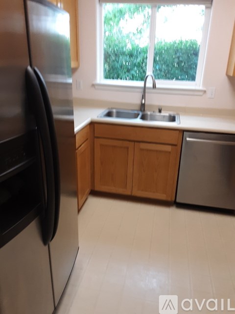 A kitchen with a sink and a window.