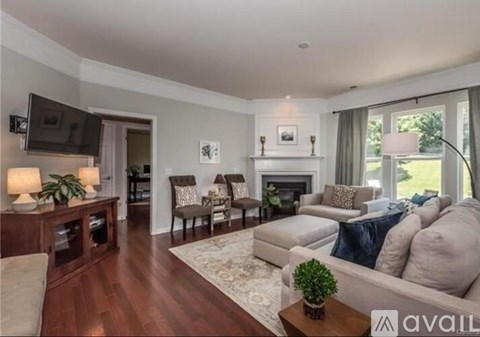 A living room with a fireplace and a couch.
