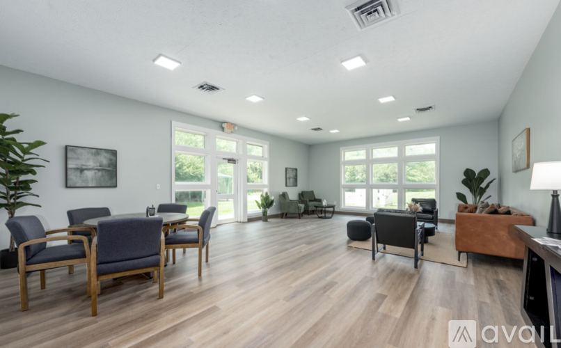 A living room with wooden floors and furniture.