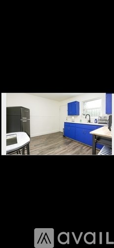 A room with a desk and a cabinet.