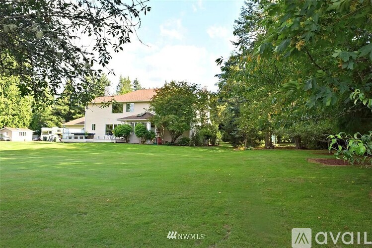 A house with a lawn in front of it.