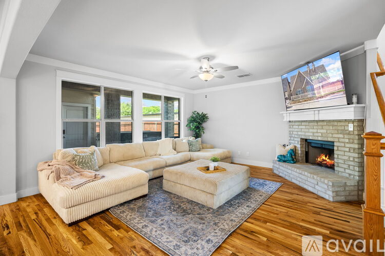 A living room with a fireplace and a couch.