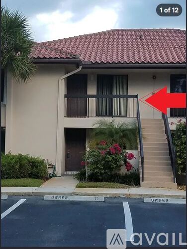 A red arrow is pointing to the stairs leading to a house.