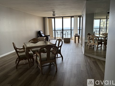A dining room with a table and chairs is shown.