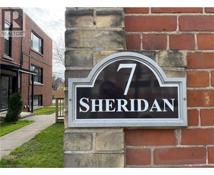 A sign with the number 7 and the word Sheridan on it.