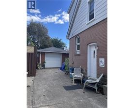 A house with a garage and a white door.