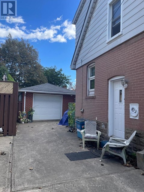 A house with a white door and a garage with a white door.