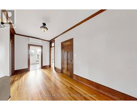A room with wooden floors and white walls.