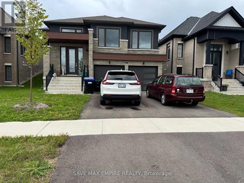 A white car is parked in front of a house.