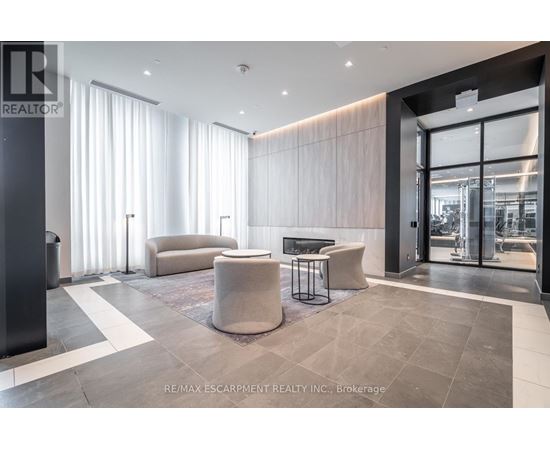 A modern living room with a black and white checkered floor.