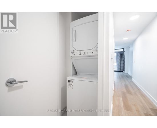 A white oven and microwave in a kitchen.