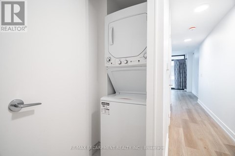 A white oven and microwave in a kitchen.