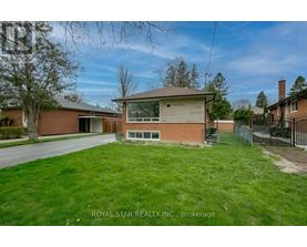 A house with a yard is for sale by Royal Star Realty.