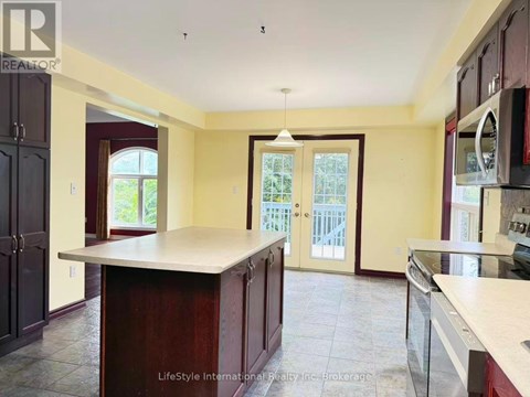 A kitchen with a large island in the middle.