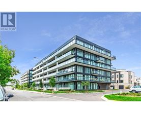 A modern multi-story building with a glass facade is the main focus of the image.