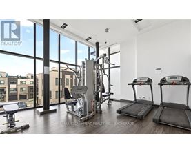 A gym with treadmills, weights, and exercise equipment.