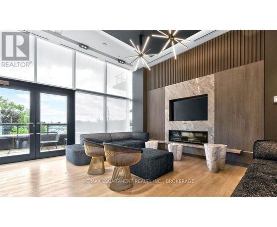 A modern living room with a large window and a flat screen TV.