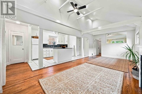 A spacious kitchen with white cabinets and a large island.