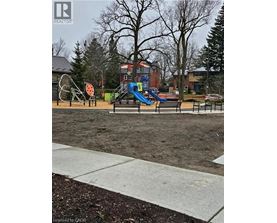 A playground with a slide and a seesaw.