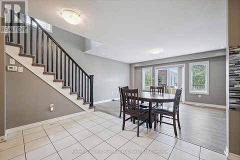 A dining room with a table and chairs is shown.