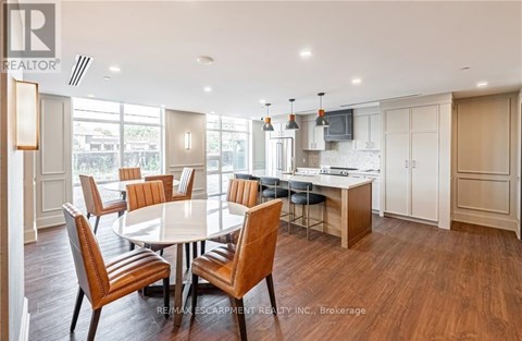 A dining room with a table set for six.