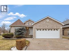 A house with a white garage door is for sale.
