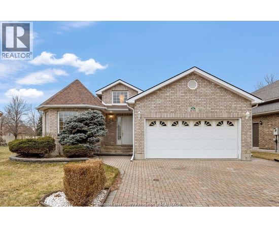 A house with a white garage door is for sale.