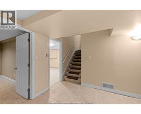 A room with a staircase leading to the upper floor.
