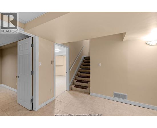 A room with a staircase leading to the upper floor.